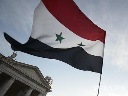 Местные жители освободили от террористов три района "столицы" ИГИЛ и вывесили сирийский флаг &ndash; СМИ