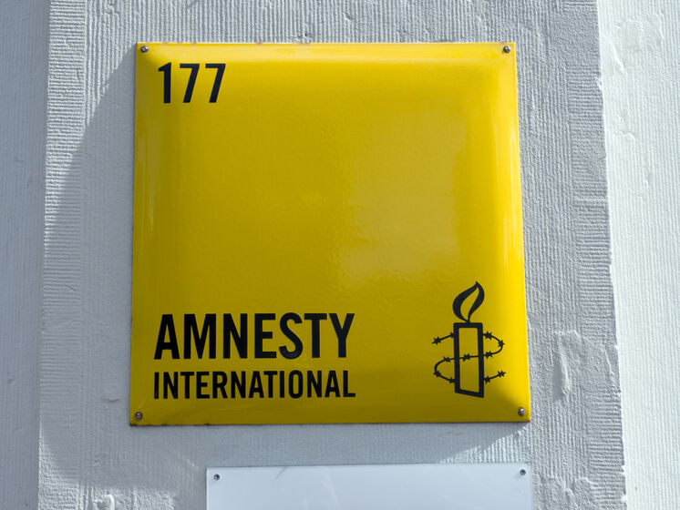 The Times  Amnesty International  .  ,  AI    