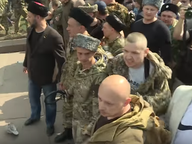 "Козаки" відшмагали соратників, які били нагайками протестувальників у Москві