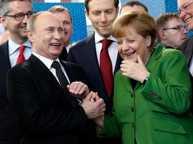 Меркель планирует встретиться с Путиным во Франции
