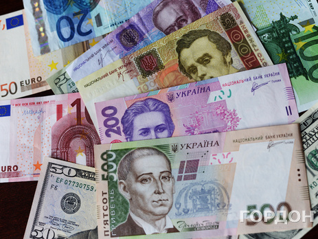 НБУ повысил официальный курс гривны к доллару на 24,3 коп.