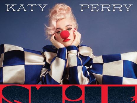 Smile. Беременная Кэти Перри в костюме клоуна станцевала под стулом в компании вставных челюстей и зубных щеток