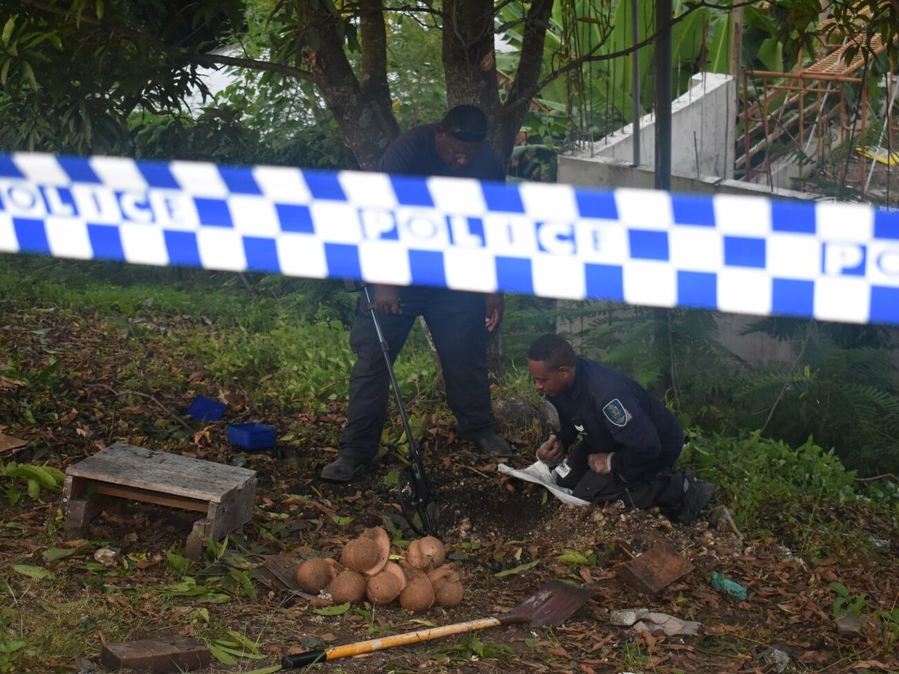 A World War II bomb detonated in the Solomon Islands.  Victims cooked food at the stake