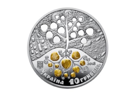 Монета выполнена из серебра с локальной позолотой