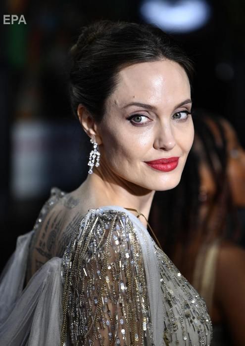 Джоли и Фаннинг представили фильм "Малефисента: Владычица тьмы" в Британии. Фоторепортаж 3